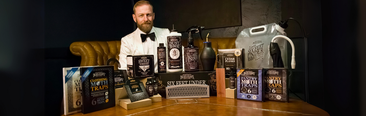 Man in a bow tie presenting Dr. Killigan's pest control products