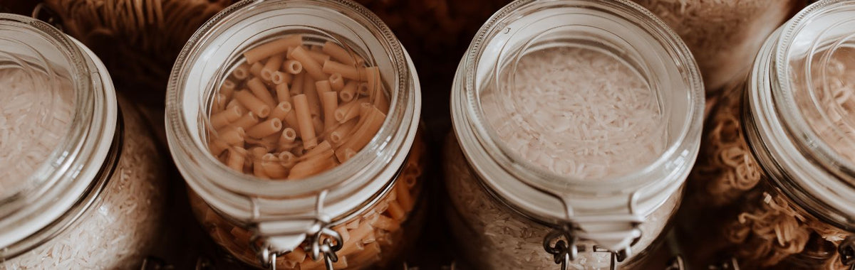 Sealed glass jars of pasta and rice, a natural way to keep pantry bugs out