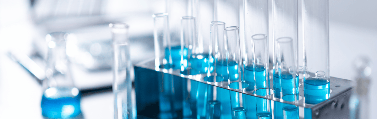 Test tubes of blue liquid, representing harmful chemicals in pest control products