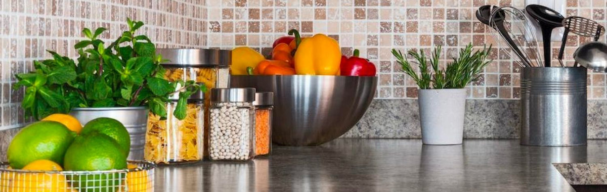 Kitchen counter with fruit and herbs whose smells can attract insects