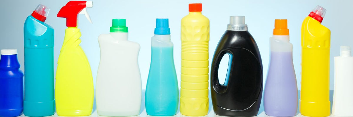 Row of colorful household cleaning product bottles