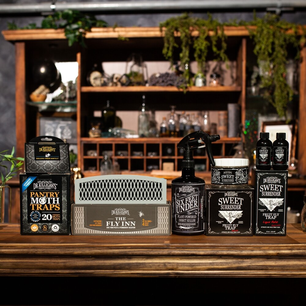 Collection of Dr. Killigan's kitchen protection system a wooden shelf. #size_large