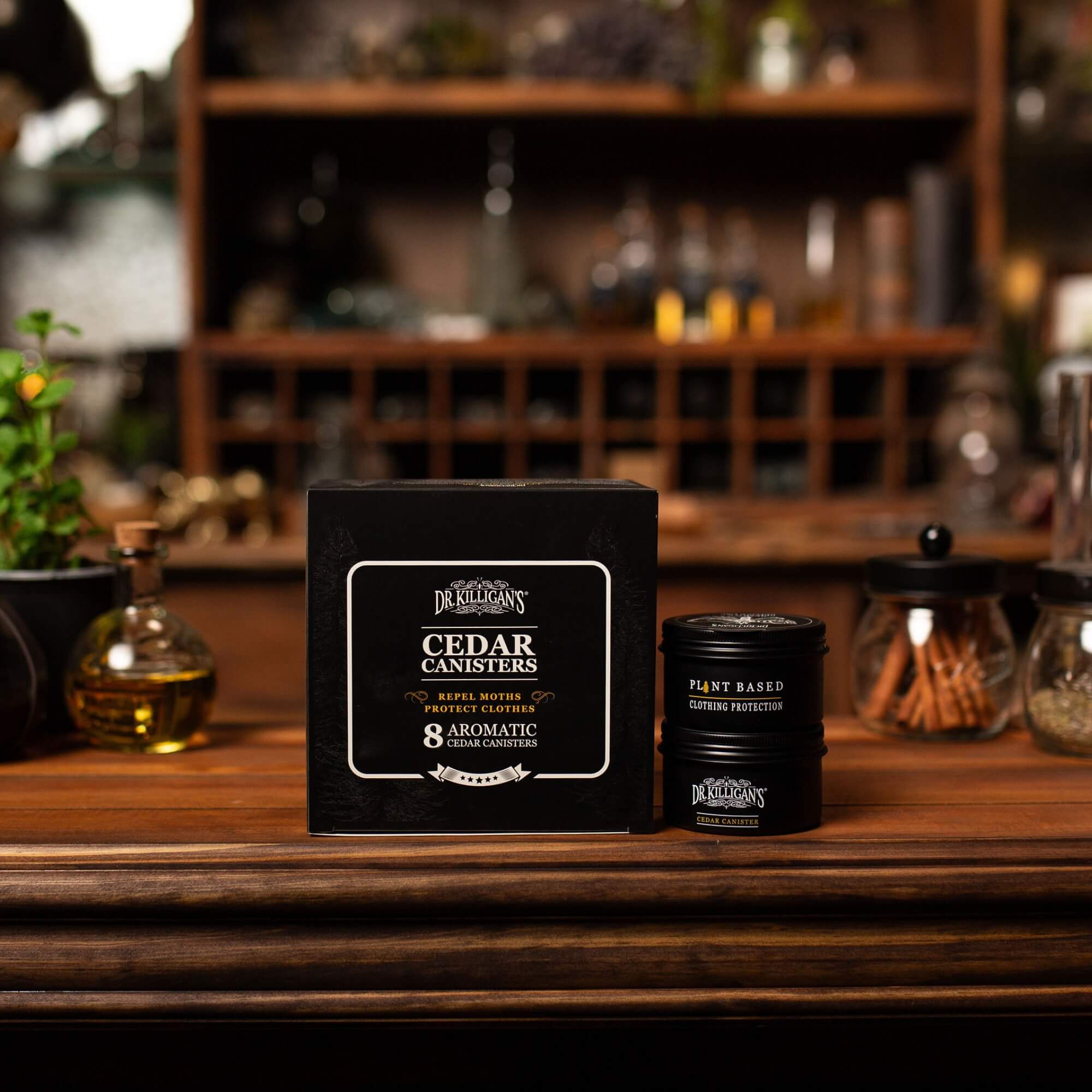 Cedar canisters with packaging on a wooden surface with a blurred background