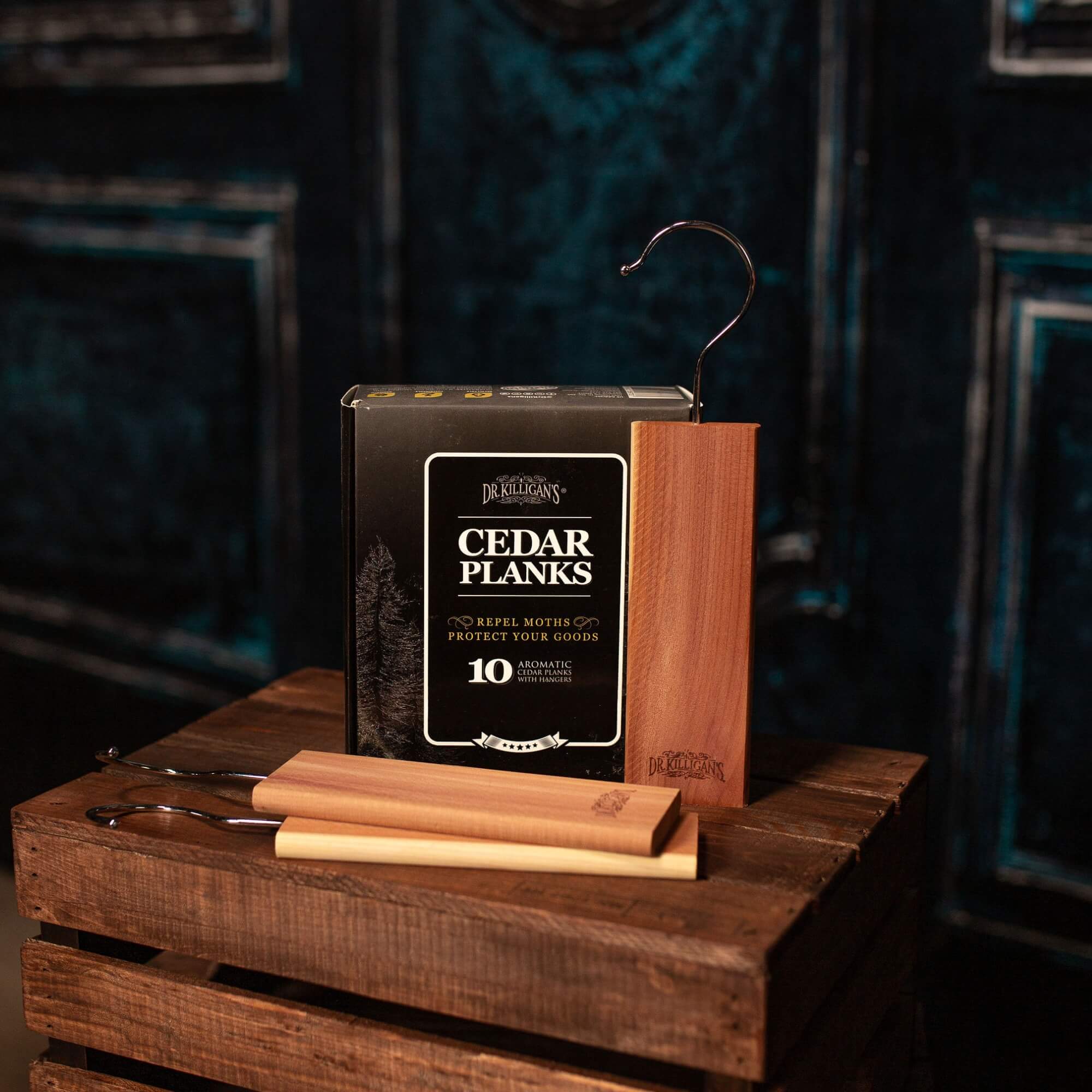 Cedar planks with packaging on a wooden crate against a dark background