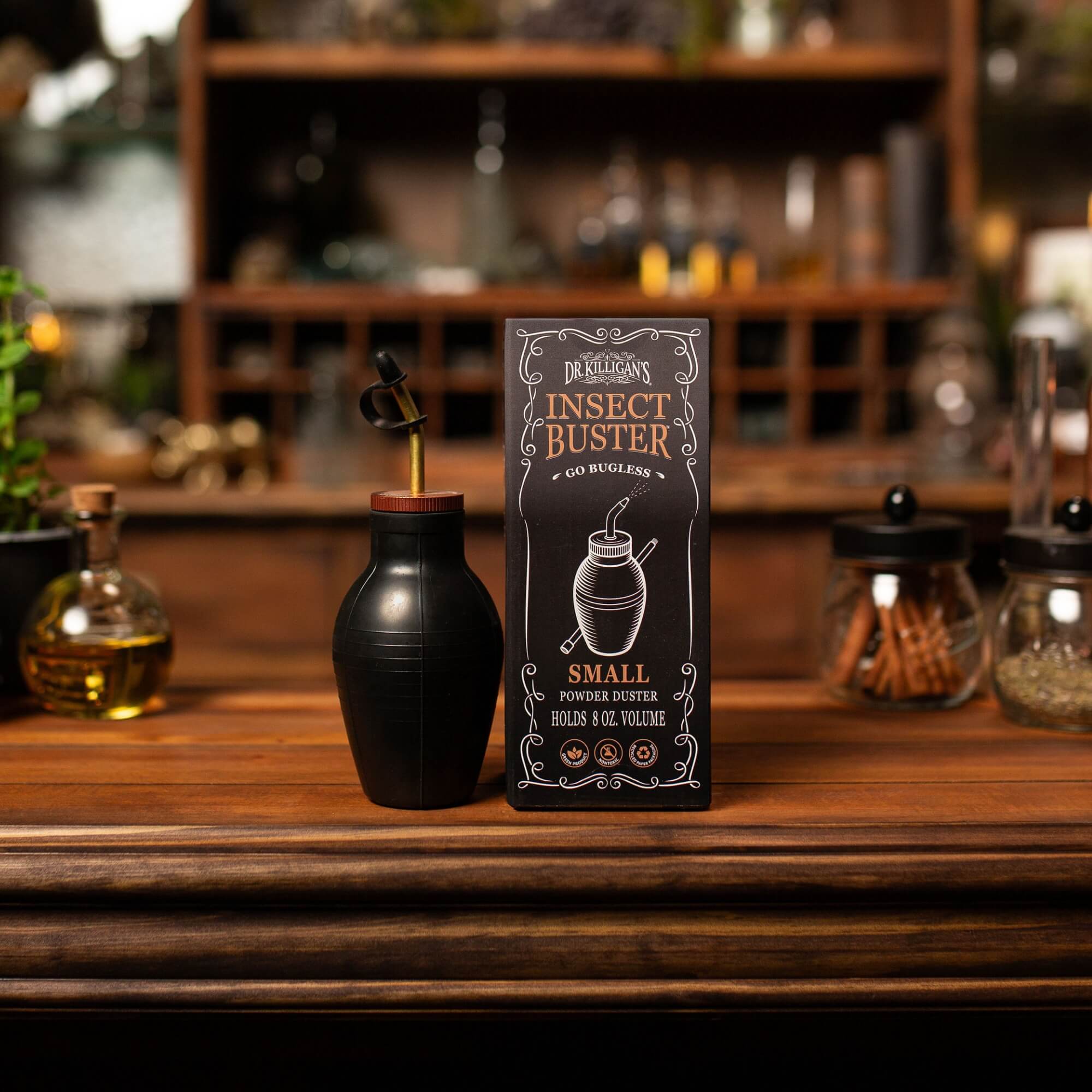 Black bulb duster and packaging on a wooden surface with a blurred bar background