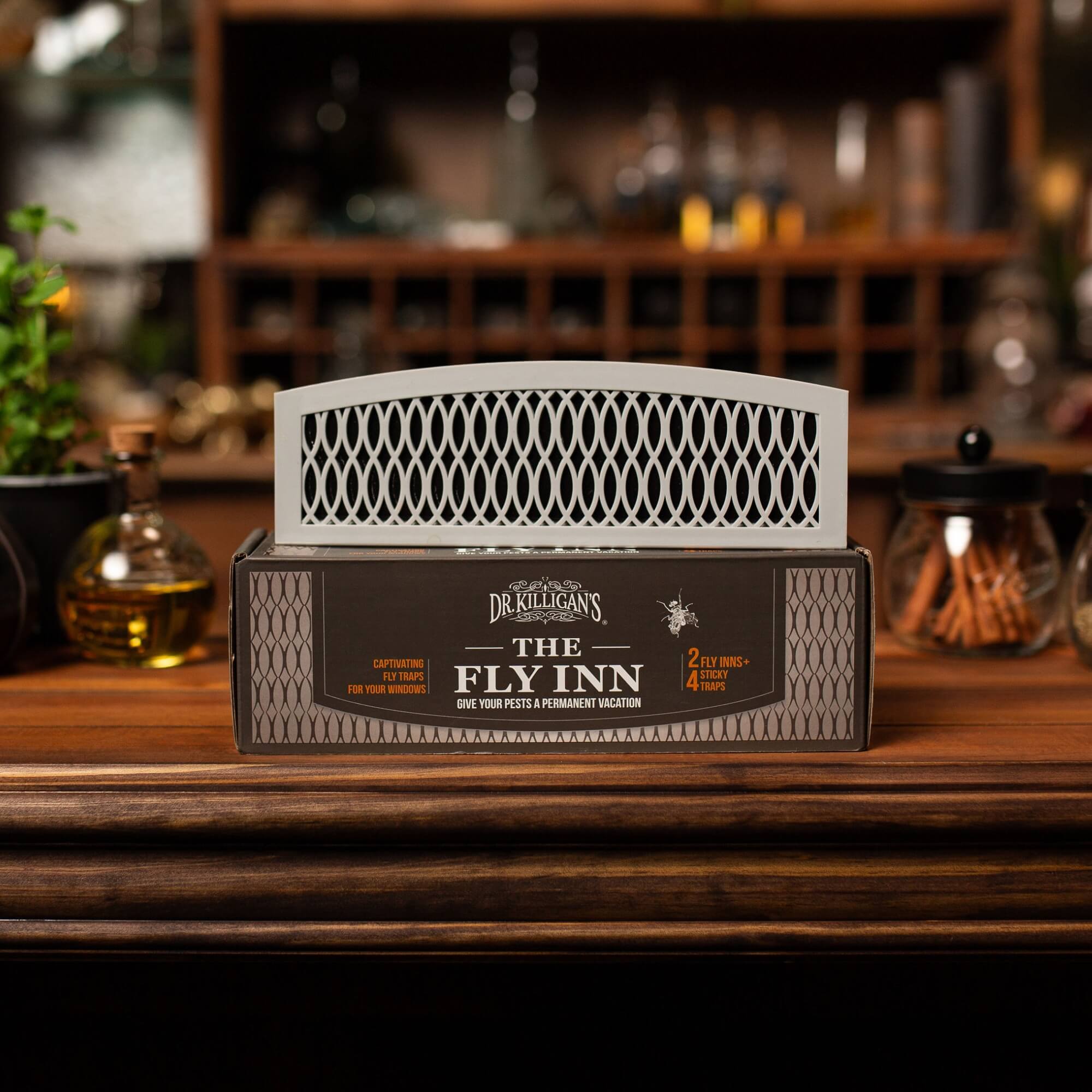 Dr. Killigan's The Fly Inn product on a wooden surface with a blurred bar background