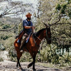 Dr. Killigan riding a horse in Costa Rica